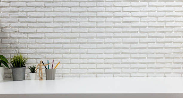 istock Mockup workspace white desk with office supplies 1263783974