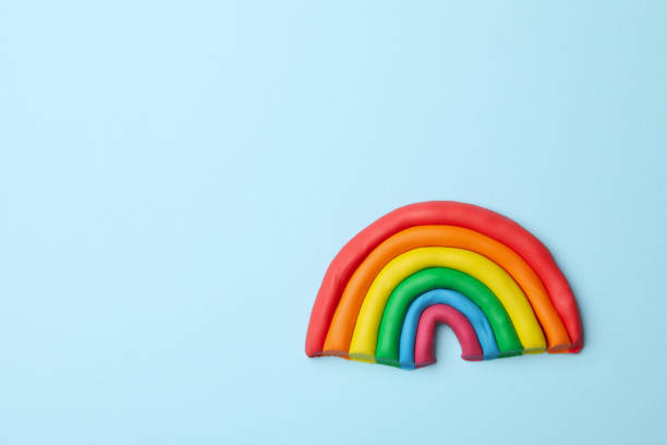istock LGBT rainbow made of plasticine on blue background 1263785224