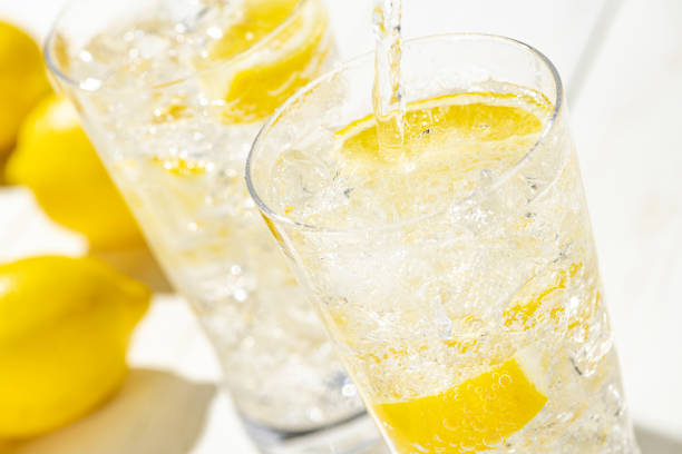 istock Highball Laced With Lemon juice Flavour. Fresh white plank background. 1263785352