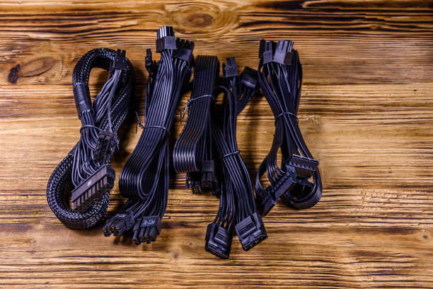 istock Set of computer psu cables on a wooden background 1263785487