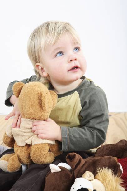 istock Preschooler with his soft toys 1263787264