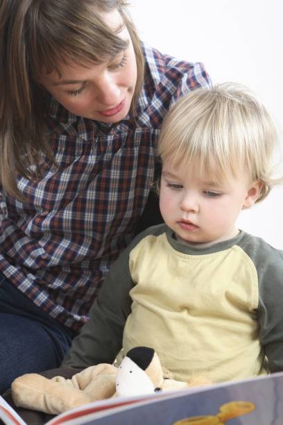 istock Mother reading to her son 1263787604
