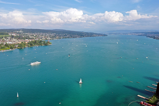 Lake Zurich - beautiful high angle view with the entire lake some ships and the villiges surrounding the lake. The imge was captured during summer season.