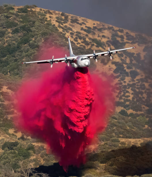 Wildfire Aircraft Tanker Wildfire aircraft drop fire retardant during the Apple Fire in southern california. military tanker airplane photos stock pictures, royalty-free photos & images