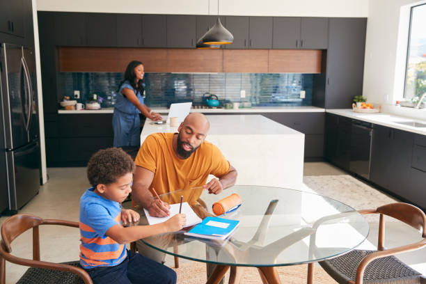 istock African American Father Helping Son Studying Homework In Kitchen 1263791398