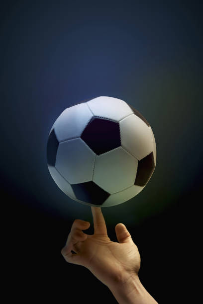 istock Balancing soccer ball with a finger 1263800646