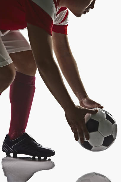 istock A soccer player holding a soccer ball 1263806753