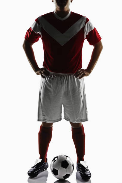 istock A soccer player posing with a soccer ball 1263813207