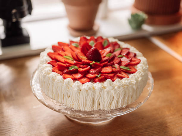 Strawberry cake indoors in kitchen typical cream cake