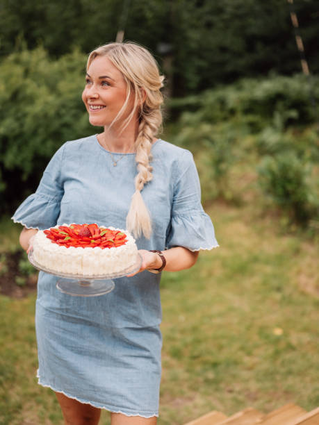 Woman holding strawberry cake outdoors in summer typical cream cake Woman holding strawberry cake outdoors in summer typical cream cake
Traditional cake with cream and strawberries typical for birthdays in summer cream cake stock pictures, royalty-free photos & images