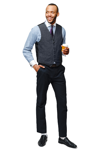 Full lenght photo of Young african american businessman holding coffee to go.