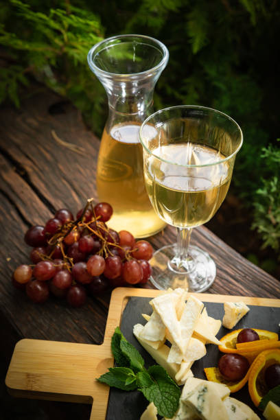 istock Carafe with white wine on a wooden table 1263821880
