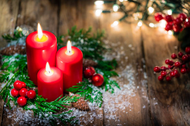 istock Christmas candles on rustic wooden table. Copy space 1263824490
