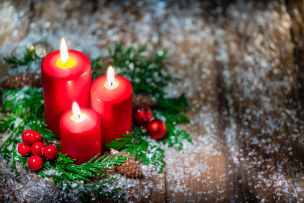 istock Christmas candles on rustic wooden table. Copy space 1263824495