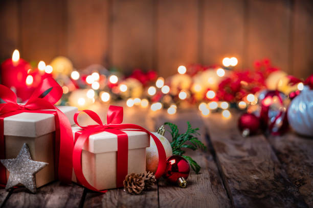 istock Christmas presents with ornaments on rustic wooden table. Copy space 1263824592