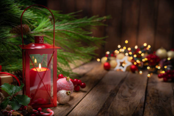 istock Christmas red lantern and Christmas decoration on rustic wooden table. Copy space 1263824691