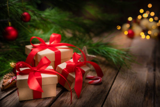 istock Christmas presents with ornaments on rustic wooden table. Copy space 1263824736