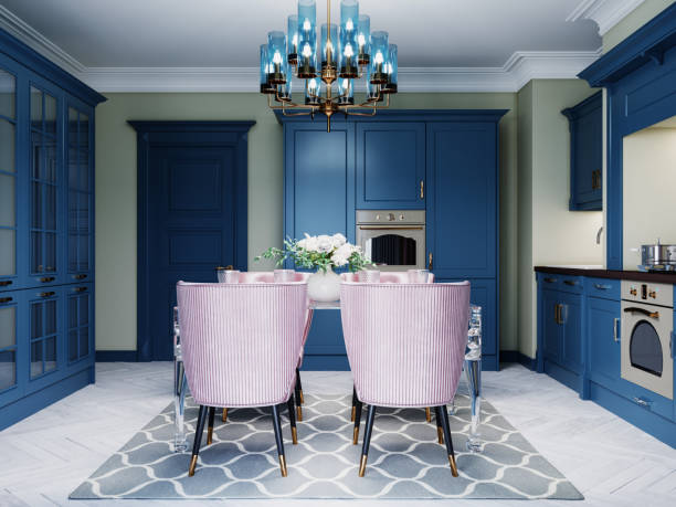 istock Dining table in the kitchen with a glass table and four soft pink chairs. Kitchen trendy design with blue mele. 1263825873
