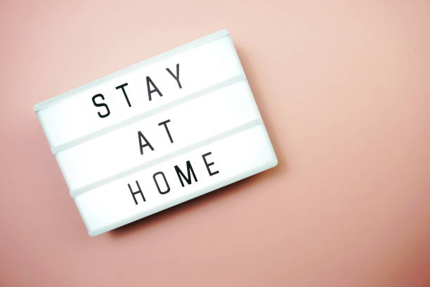 istock Stay at Home word letter in light box on pink background 1263827288