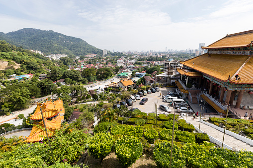 PENANG, MALAYSIA, DECEMBER 20 2017: Kek Lok Si temple, a Chinese Buddhist temple situated in Air Itam with moderne Skyline of Penang