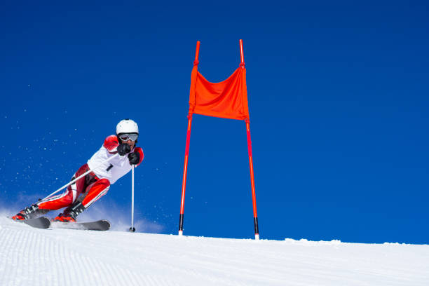 istock professional alpine skier skiing on course at clear blue sky 1263830265