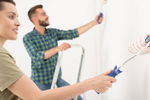 istock Couple painting room 1263831777