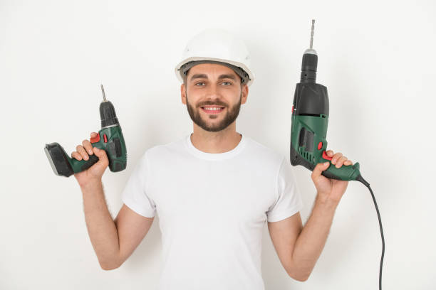 istock Smiling repairman with power tools 1263832153