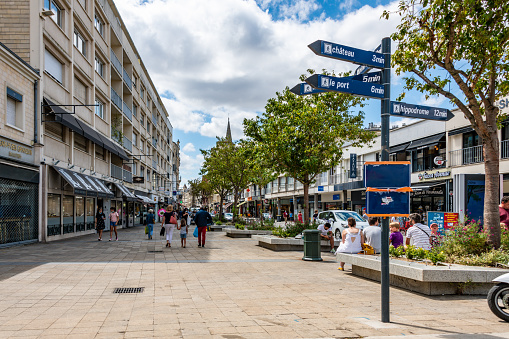 Caen, France. Monday 27 July 2020. Shops and sign post in central Caen, France