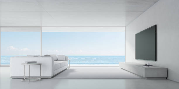 istock Concrete interior space, Modern living room with TV and sofa on sea background . 3d render. 1263842557