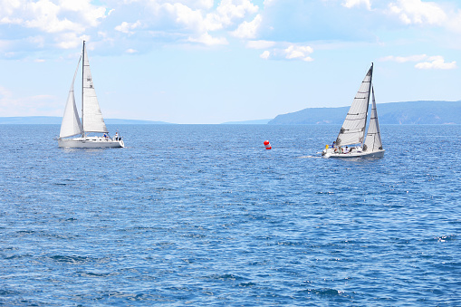 Opatija, Сroatia - July 18, 2020: Sailboats at regatta in Opatija, Croatia
