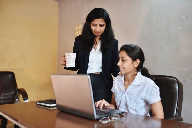 istock Female entrepreneur discussing with her female staff 1263845183