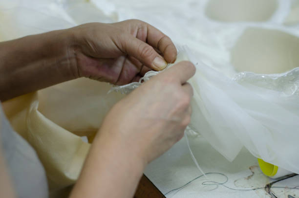 istock fashion designer sews wedding dresses 1263845742