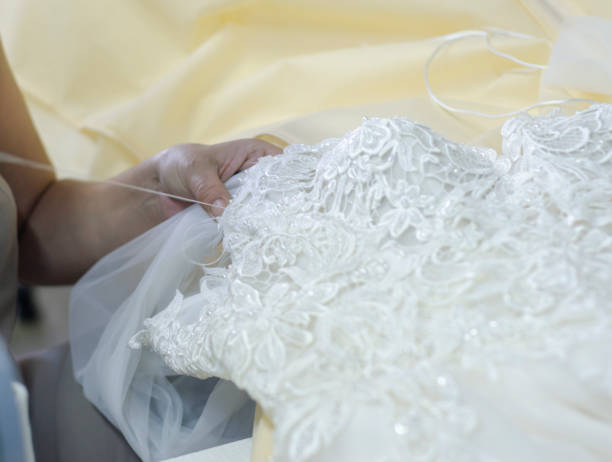 istock fashion designer sews wedding dresses 1263846227