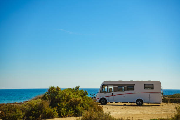 istock Camper car on beach, camping on nature 1263846641