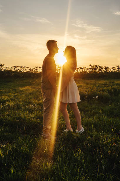 istock Loving couple in the field. Sunset. 1263847938