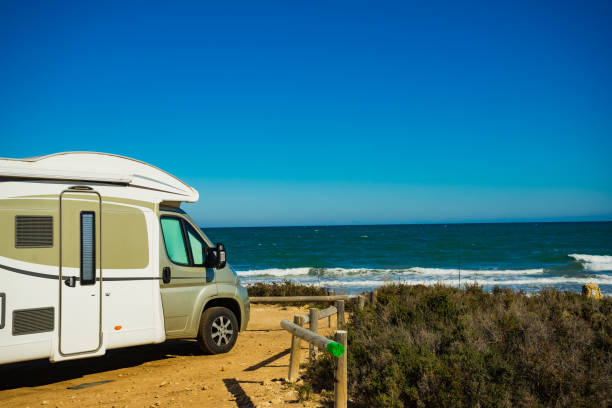 istock Camper car on beach, camping on nature 1263848023