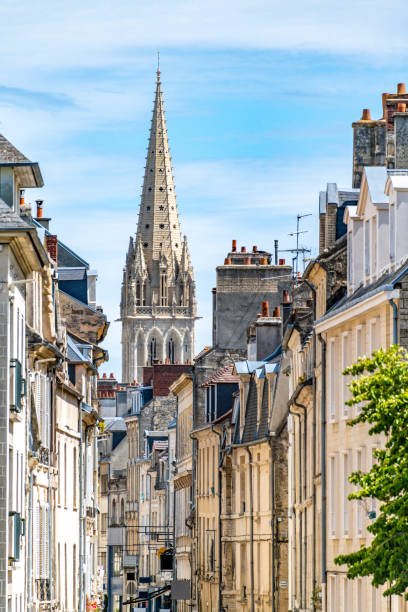 View over shops to a church spire in central Caen, France View over shops to a church spire in central Caen, France caen photos stock pictures, royalty-free photos & images