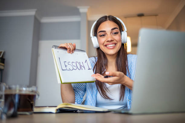 Millennial pleasant professional female tutor giving online language class. Education and e-learning on universities - using new platforms to share knowledge. Experienced teacher or professor explaining chemistry or other science over internet to students professor business classroom computer stock pictures, royalty-free photos & images