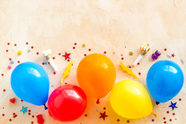 istock Flat lay with ballons - party concept - on beige background top-down copy space 1263850284