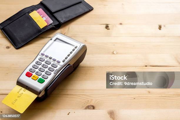 Payment By Credit Card Terminal On Wooden Table Copy Space Stock Photo - Download Image Now