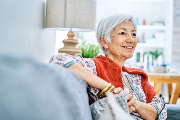 istock Content senior woman relaxing on her sofa at home 1263851986