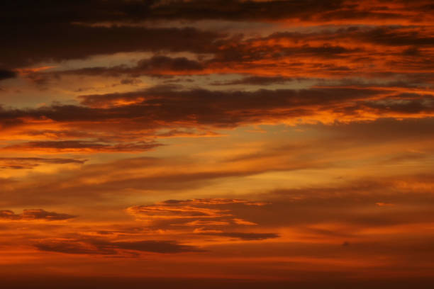 istock Sunset lighting and orange sky with cloud as background 1263853874