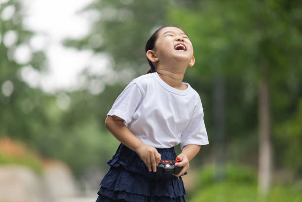 Cute little girl Playing with remote control toys with the remote control