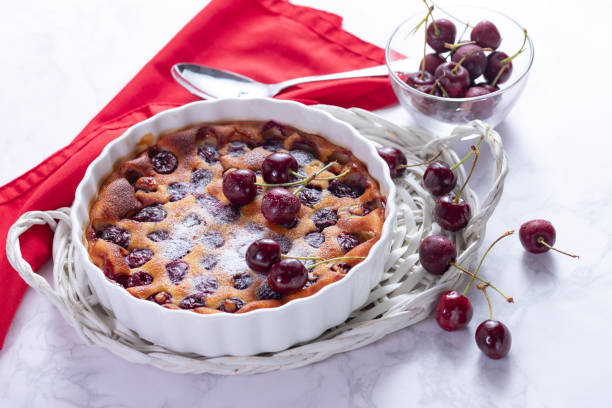istock Traditional french cherry clafoutis with cherry on white marble 1263857026