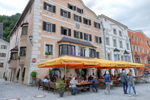 Rattenberg, Austria - July 12 2019: Cityscape of Tyrol Town Rattenberg in Austria. Historical city center with architectural features. People sitting in restaurants