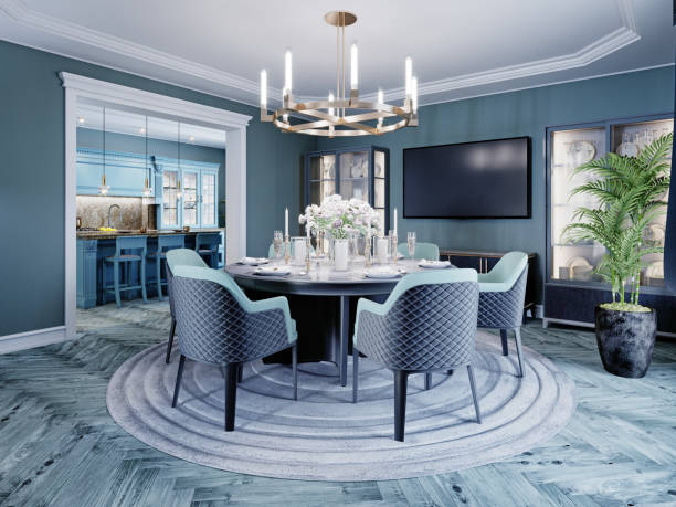 istock Modern luxurious dining room in blue, white and black color with a large round served table and chairs. 1263859074