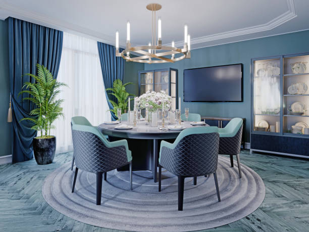 istock Modern luxurious dining room in blue, white and black color with a large round served table and chairs. 1263859233