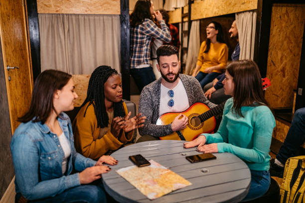 istock Hostel roommates singing and partying 1263860711