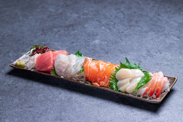 Japanese food mixed sashimi on gray stone Sashimi Plate shiso photos stock pictures, royalty-free photos & images