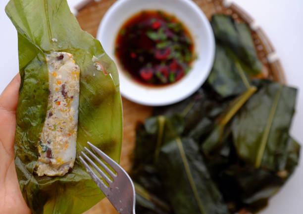 people eating flat rice dumpling on tray food background, special cake of Hue, delicious vegan rice flour dish